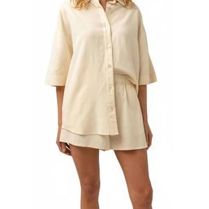 NEW RHYTHM. classic beach shorts in butter